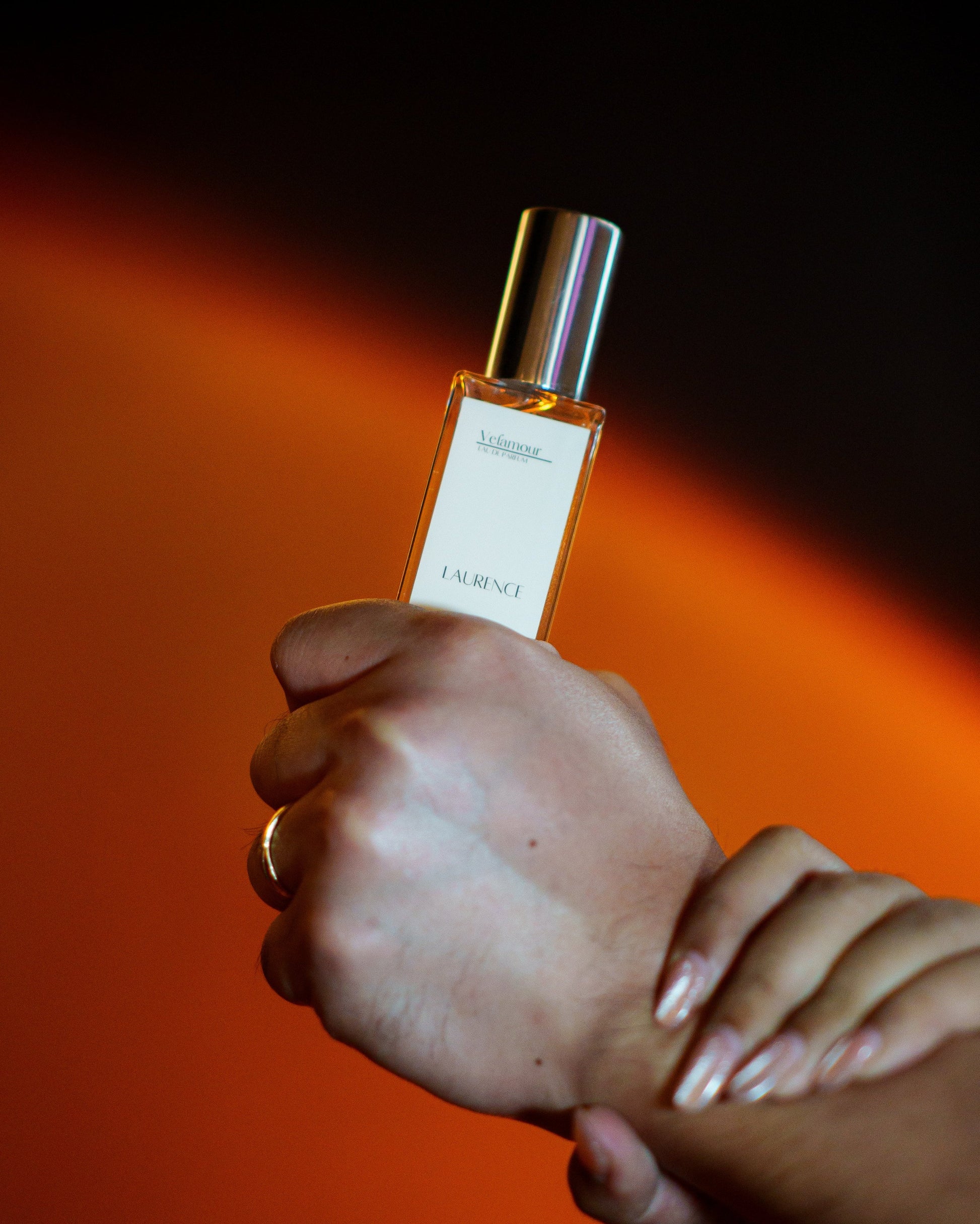 A Man's Wrist with Laurence Perfume, Exuding Freshness and Vitality